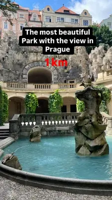 a fountain in a park with the view in at Romantic apartment by the city center in Prague