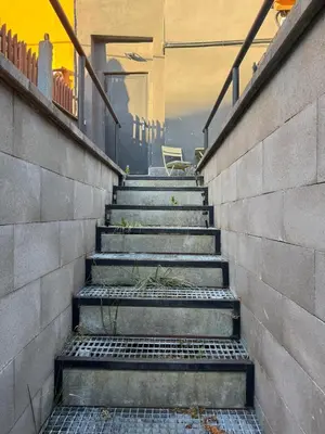 a set of stairs leading up to a house at Suterénní apartmán na Hejtmánce u letiště v Mladé Boleslavi in Mladá Boleslav