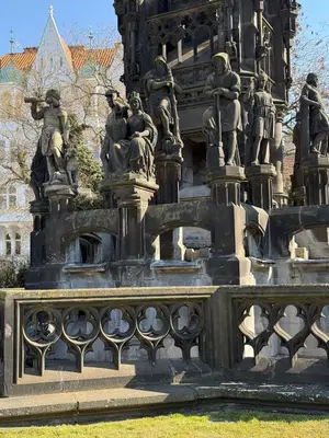 a fountain with statues of people on it at Riverside N22 in Prague