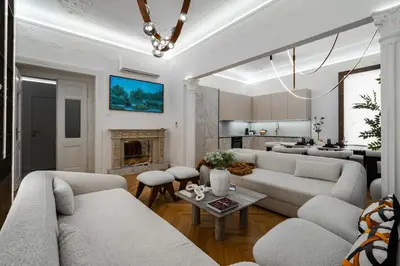a living room with couches and a fireplace at Riverside N22 in Prague