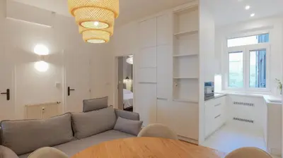 a living room with a couch and a table at Royal Apartment on Wenceslas Square in Prague