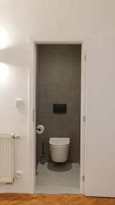 a bathroom with a toilet in a room at Royal Apartment on Wenceslas Square in Prague