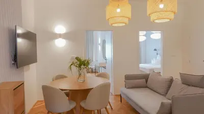 a living room with a couch and a table at Royal Apartment on Wenceslas Square in Prague