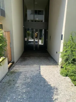 a hallway leading to a building with a door at Diamond on Wenceslas Square in Prague