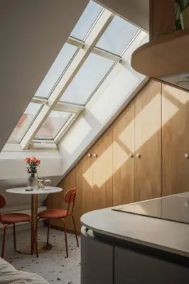 a skylight in a kitchen with a table and chairs at NEW! Mini-designer rooftop AC & Garden, Castle! in Prague
