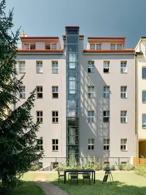 a building with a picnic table in front of it at NEW! Mini-designer rooftop AC & Garden, Castle! in Prague