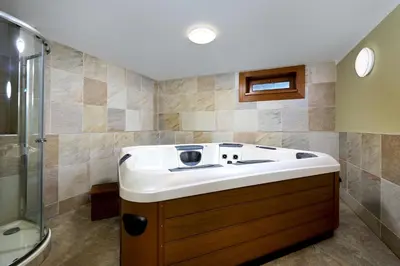 a bathroom with a sink and a shower at Ranči v Buši - pokoj ve srubu in Čím
