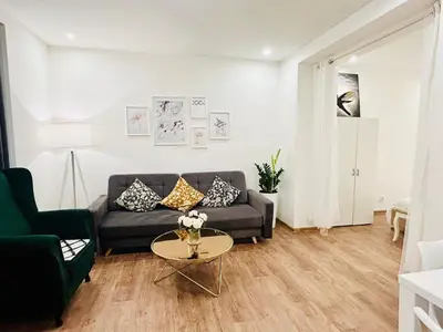 a living room with a couch and a table at New luxury style apartment in central Prague in Prague