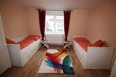 two beds in a room with a window at Dreamy Apartment in Prague
