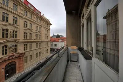 a view of a balcony of a building from a window at Apartments Vorsilska in Prague