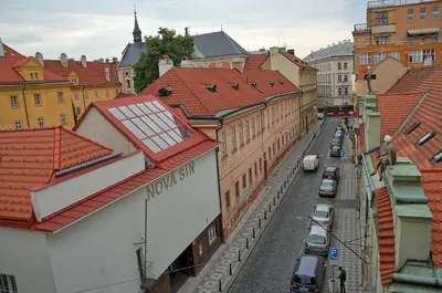 a view of a city street with buildings and cars at Apartments Vorsilska in Prague