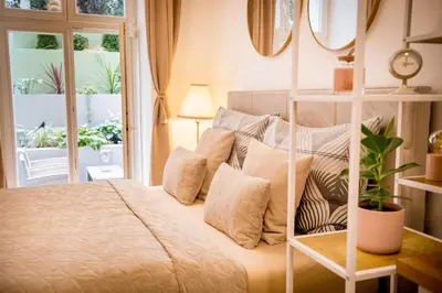 a bedroom with a bed with pillows at The Wenceslas Square Terrace in Prague