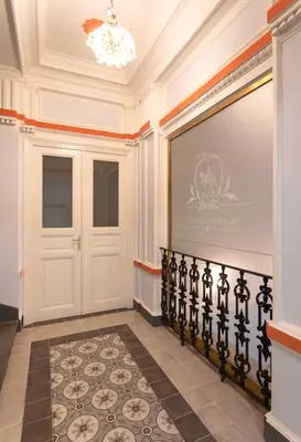 a hallway with a white door and a wall at The Wenceslas Square Terrace in Prague