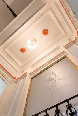 a coffered ceiling in a room with a painting on it at The Wenceslas Square Terrace in Prague