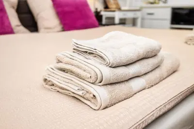 a pile of towels sitting on top of a table at Royal Charlie Suite in Prague