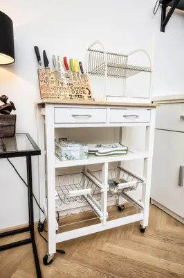 a white desk with two baskets on top at Royal Charlie Suite in Prague