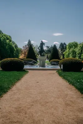 a path leading to a statue in a park at Apartmán Slunce in Poděbrady
