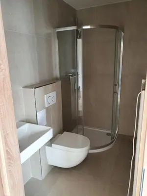 a bathroom with a toilet and a shower at Útulný apartmán na Slapech in Čím