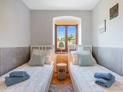 a room with two beds and a window at Holiday Home Svatá by Interhome in Svatá