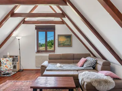 a living room with a couch and a table at Holiday Home Svatá by Interhome in Svatá