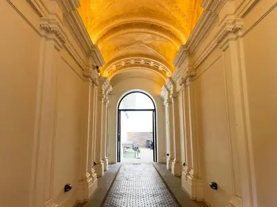 an empty hallway in a building with a ceiling at Vintage & Modern - best of both worlds in the heart of Prague in Prague