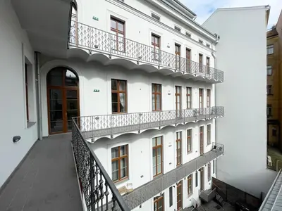 an external view of a white building with balconies at Vintage & Modern - best of both worlds in the heart of Prague in Prague
