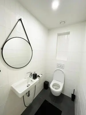 a white bathroom with a sink and a toilet at Vintage & Modern - best of both worlds in the heart of Prague in Prague