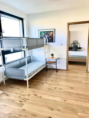 a room with two bunk beds and a mirror at Apartmantplus01 in Prague