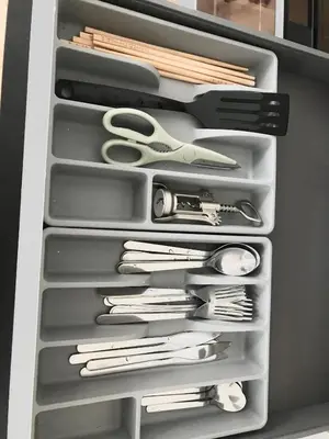 a drawer filled with scissors and other kitchen utensils at Apartmantplus01 in Prague