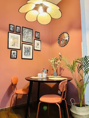 a dining room with a table and two chairs at Quiet and Cozy Apartment by the Walls of Vyšehrad in Prague