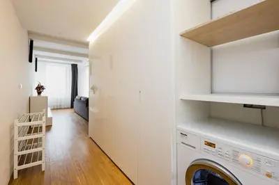a laundry room with a washer and dryer in it at Central Prague Residence Karlín in Prague