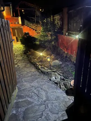 a stone walkway in a yard at night at Country home Chez Nous U nas in Tetín