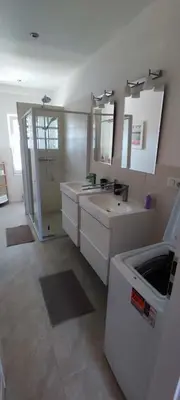 a large bathroom with two sinks and a shower at Country home Chez Nous U nas in Tetín