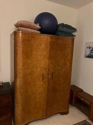 a wooden cabinet with a ball on top of it at Country home Chez Nous U nas in Tetín