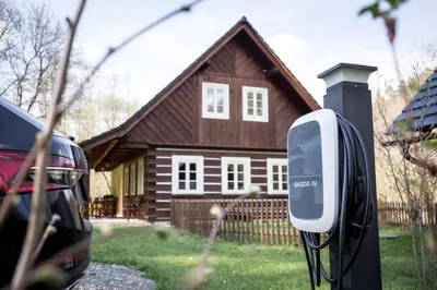 a car is hooked up to a meter in front of a house at Roubenka pod hradem Kokořín in Kaninský Dŭl