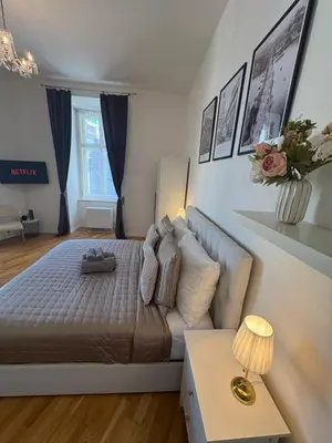 a bedroom with a bed and a couch at Cozy Flat in the Heart of Prague in Prague