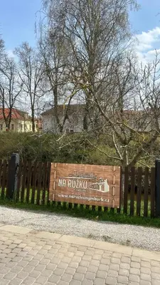 a wooden fence with a sign on it at VilaVala in Nymburk
