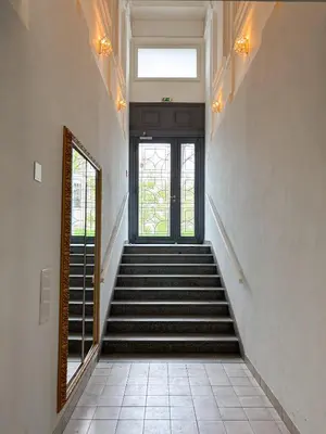 a staircase leading to a door in a building at Museum Park Apartment in Prague