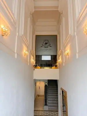 a hallway with a staircase in a building at Museum Park Apartment in Prague