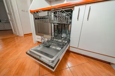 a dishwasher with its door open in a kitchen at 5 Bob's Apartment - 2 bedrooms with King Size beds in Prague