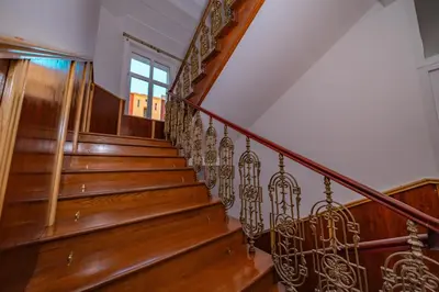 a staircase in a home with wooden stairs and a window at 5 Bob's Apartment - 2 bedrooms with King Size beds in Prague