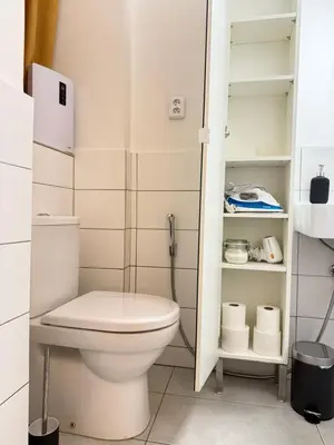 a bathroom with a toilet and a shower at The Rest Point Prague in Prague