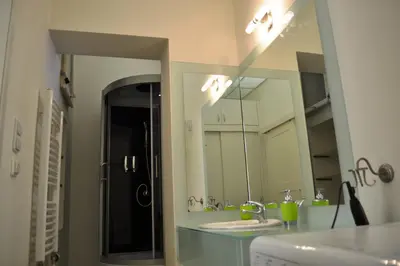 a bathroom with two sinks and a large mirror at Sunflower 2BDR Flat By Ruterra in Prague