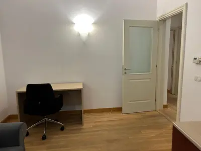 a room with a desk and a chair and a door at Vip Prague Apartments Petrska 25 in Prague