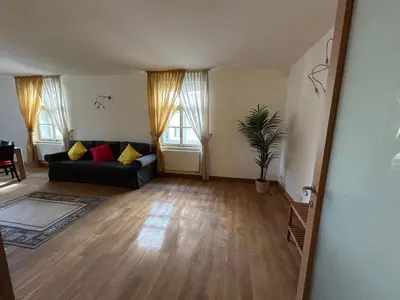 a living room with a couch and a table at Vip Prague Apartments Petrska 25 in Prague