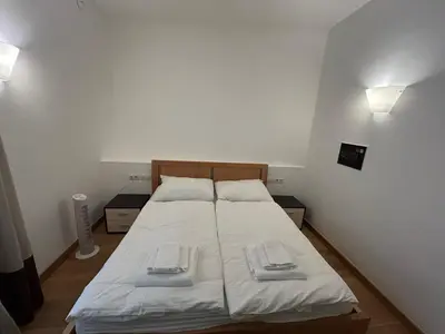 a bedroom with a bed with two towels on it at Vip Prague Apartments Petrska 25 in Prague