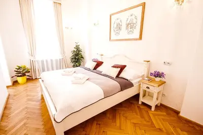 a bedroom with a large bed in a room at Florentinum Residence Prague Old Town in Prague