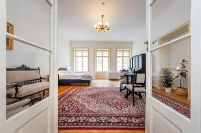 a hallway with a living room and a bedroom at Nerudova Lesser Town Apartments in Prague