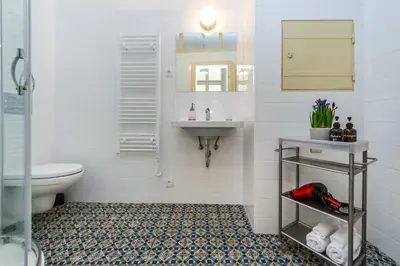 a bathroom with a sink and a toilet at Nerudova Lesser Town Apartments in Prague