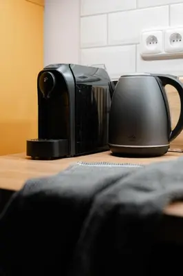 a toaster sitting on top of a table at Meloun City Center Residence in Prague